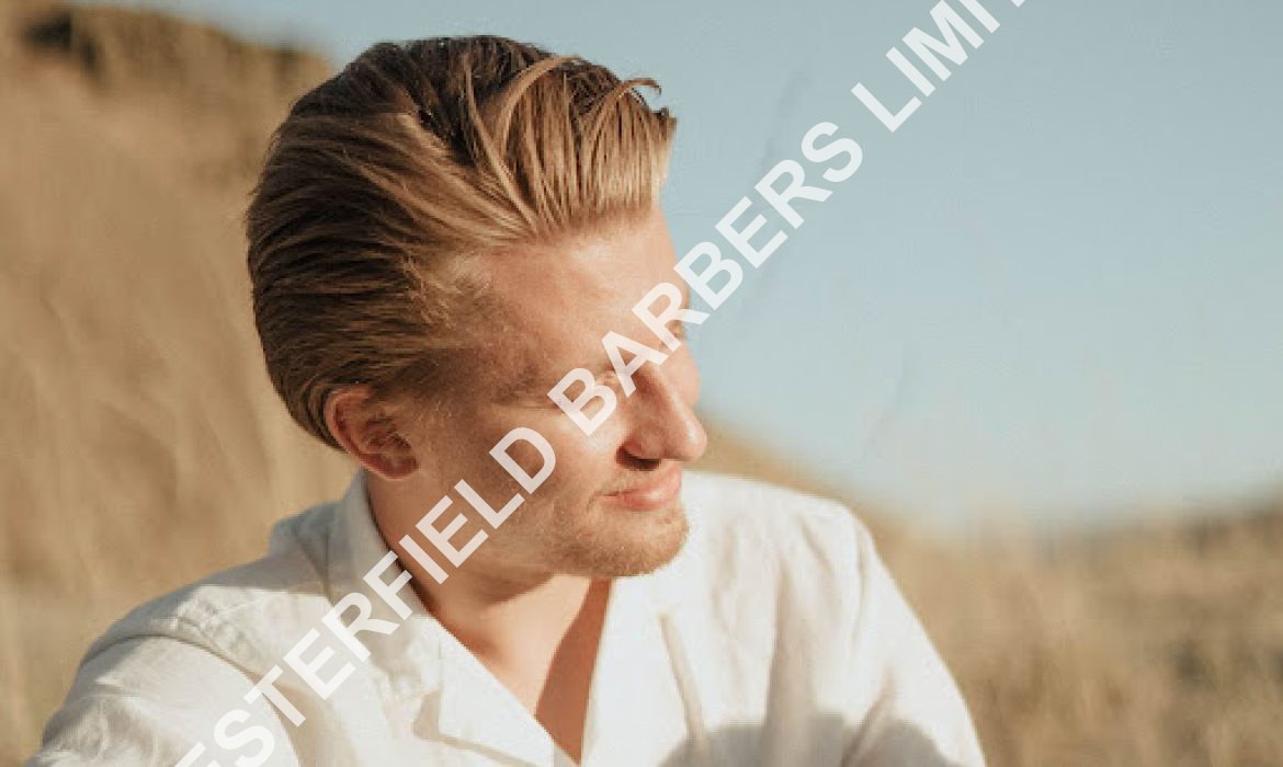 man-with-highlights-sitting-on-a-beach